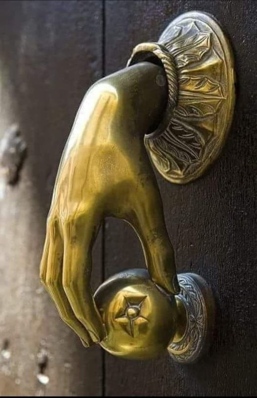 The Art of Entrance: Unveiling the Mystique of the Brass Hand with Apple Door Knocker