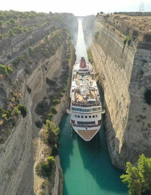 The giant cruise ship 'sucked its belly' through the narrow canal to set a record