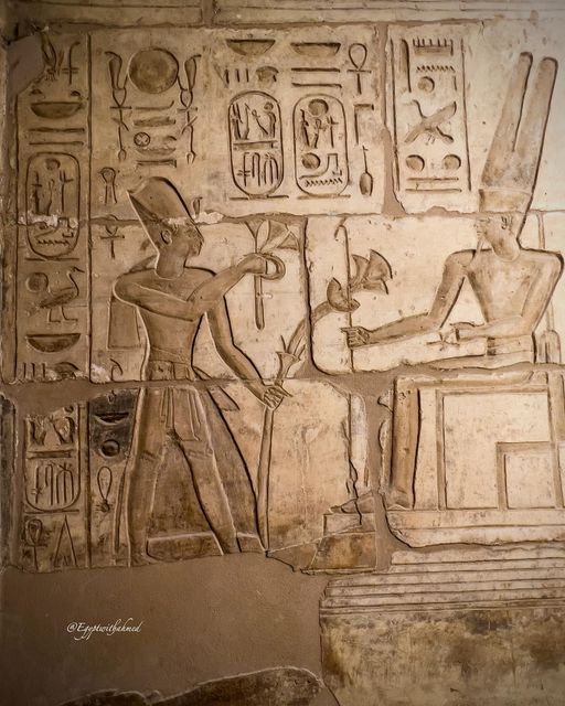 Ramesses Il offering flowers to Amun Ra