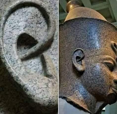 Behold the "Amenhotep III" red granite statue, showcasing impeccable precision sculpting that reveals intricate details of the ear!