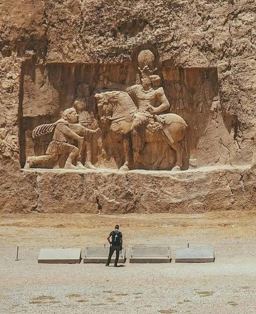Roman emperor Philippus the Arab kneeling in front of Persian King Shapur I, Naqshe Rostam, Iran.